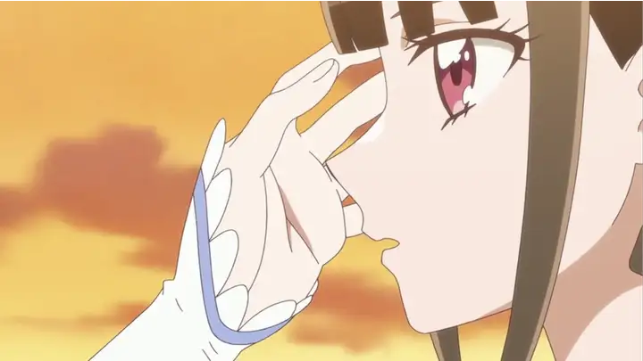 まゆの髪についた葉っぱを取るキュアニャミー